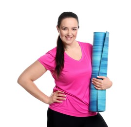 Happy overweight woman with yoga mat on white background