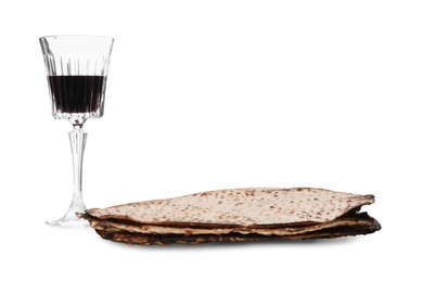 Tasty matzos and wine on white background. Passover (Pesach) celebration