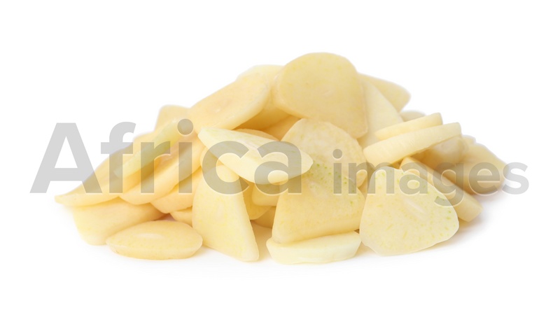 Pile of fresh sliced garlic cloves isolated on white. Organic food