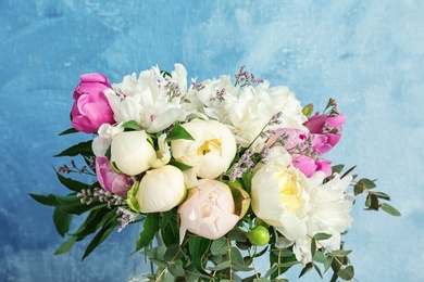 Photo of Bouquet of beautiful flowers on color background