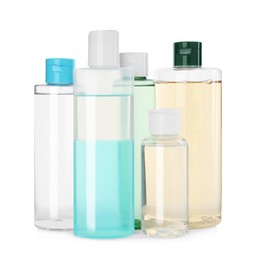 Bottles of micellar cleansing water on white background