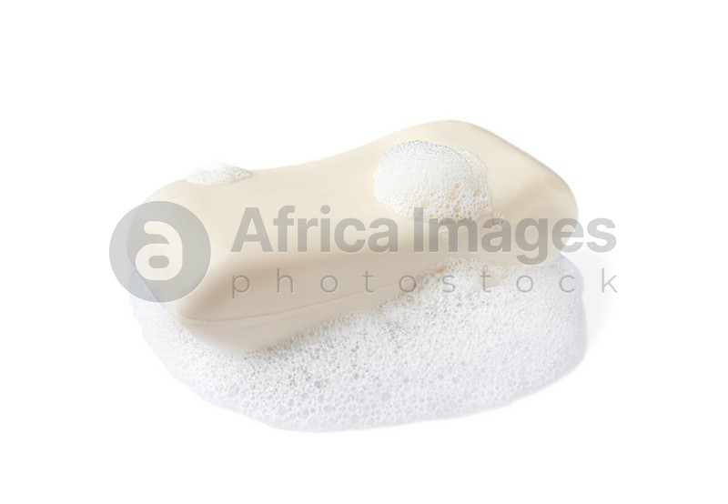 Soap with fluffy foam on white background