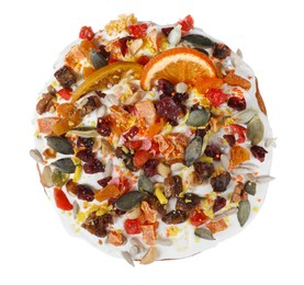 Photo of Traditional Easter cake with sprinkles and dried fruits isolated on white, top view