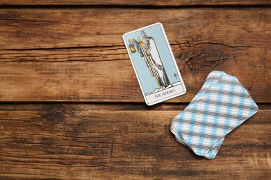 The Hermit and other tarot cards on wooden table, flat lay. Space for text