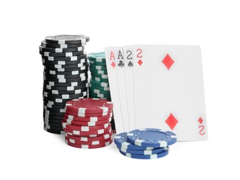 Playing cards and plastic casino chips on white background. Poker game