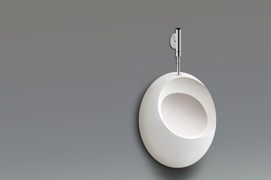 Clean ceramic urinal in men's public bathroom. Space for text