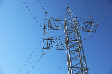 Modern high voltage tower against blue sky
