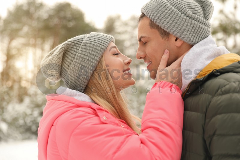 Beautiful happy couple outdoors on winter day