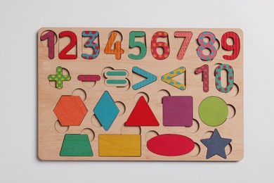 Photo of Wooden math game kit for children on white table, top view