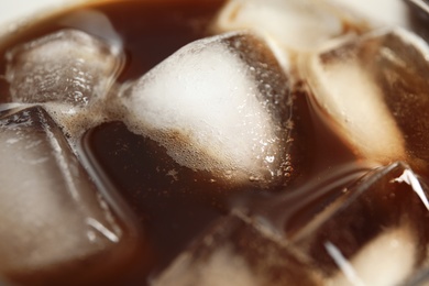Tasty coffee drink with ice cubes, closeup