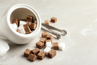 Bowl and refined sugar cubes on light table