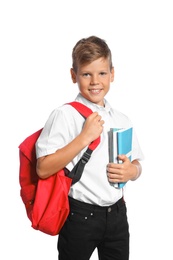Photo of Little boy with backpack and notebooks on white background. Stationery for school