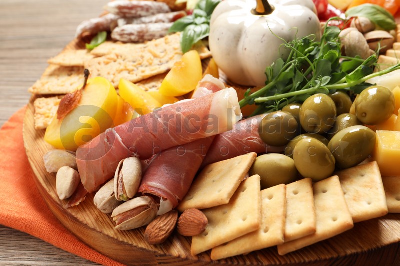 Different tasty appetizers on wooden table, closeup