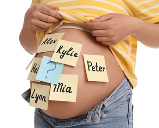 Pregnant woman with different baby names on belly against white background, closeup
