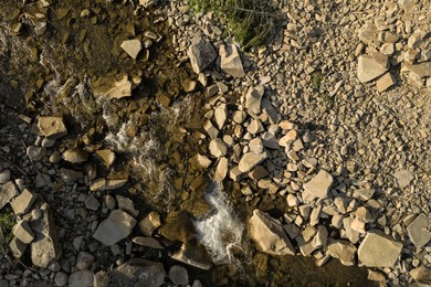 Aerial view of rocky terrain with creek. Drone photography