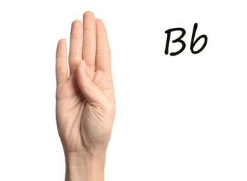 Woman showing letter B on white background, closeup. Sign language