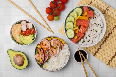 Photo of Set of delicious poke bowls with different ingredients on white table, flat lay