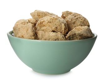 Dehydrated soy meat chunks in bowl on white background