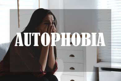 Depressed young woman crying at home. Autophobia - fear of isolation