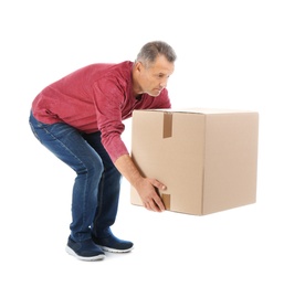 Full length portrait of mature man lifting carton box on white background. Posture concept
