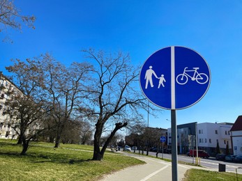 Road sign Shared Lane Bicycles and Pedestrians on sunny day