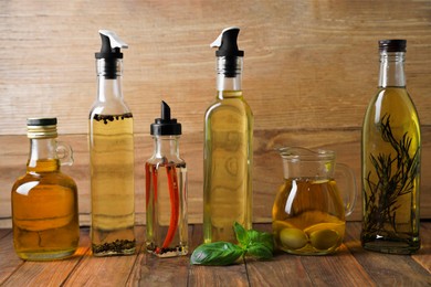 Many different cooking oils on wooden table