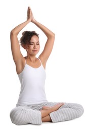 Beautiful African-American woman meditating on white background