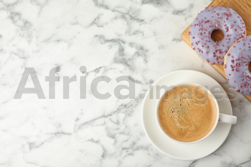 Photo of Delicious pastries and coffee on marble table, flat lay. Space for text