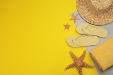 Flat lay composition with beach objects on color background, space for text