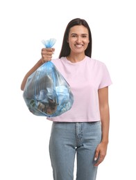 Woman holding full garbage bag on white background