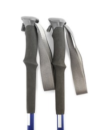 Photo of Pair of trekking poles on white background, top view. Camping tourism