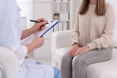 Photo of Young woman having appointment with STD specialist in clinic, closeup