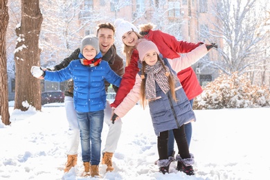 Portrait of happy family in winter park