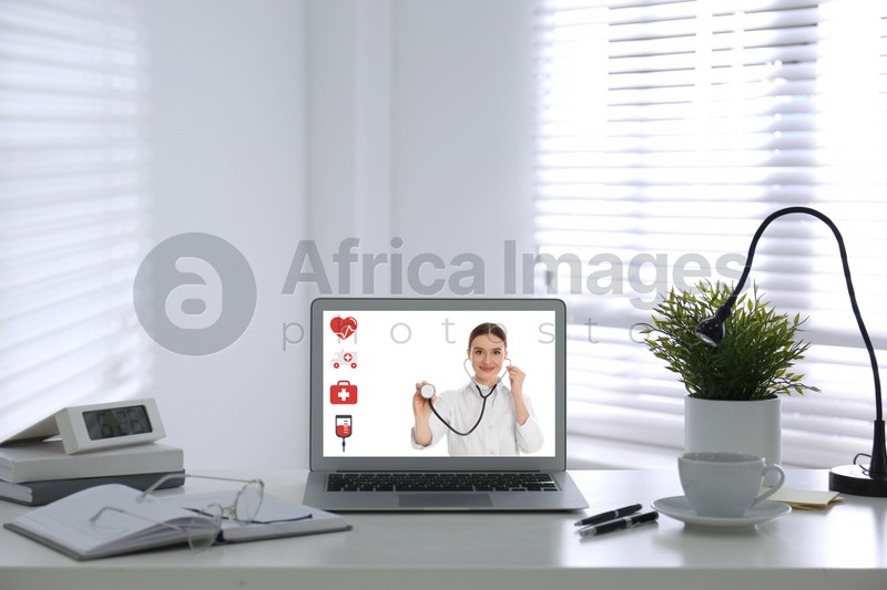 Image of  Laptop for video chat with doctor in office. Online consultation