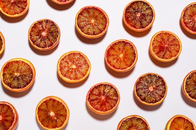 Many ripe sicilian oranges on white background, flat lay