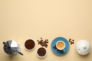 Flat lay composition with espresso, ground coffee and roasted beans on beige background, space for text