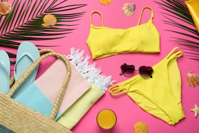 Photo of Flat lay composition with different beach objects on pink background