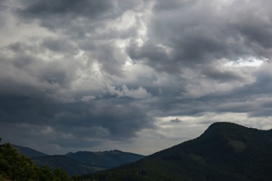 Photo of Picturesque view of cloudy sky over majestic mountain landscape
