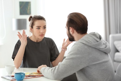 Young couple having argument at home