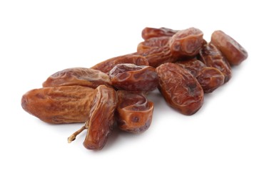 Sweet dates on branch against white background. Dried fruit as healthy snack