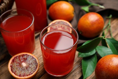 Tasty sicilian orange juice and fruits on wooden table