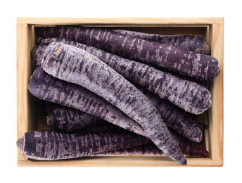 Raw black carrots in wooden crate isolated on white, top view