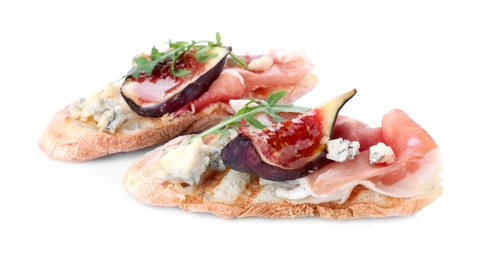 Sandwiches with ripe figs and prosciutto on white background