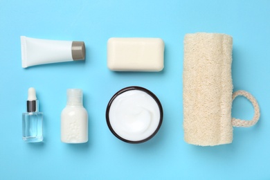 Flat lay composition with body care products on color background