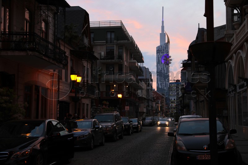 BATUMI, GEORGIA - MAY 31, 2022: Beautiful city street with buildings and cars in evening
