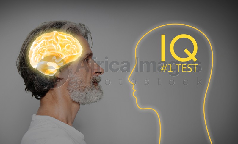 Mature man and illustrated brain on grey background. IQ test