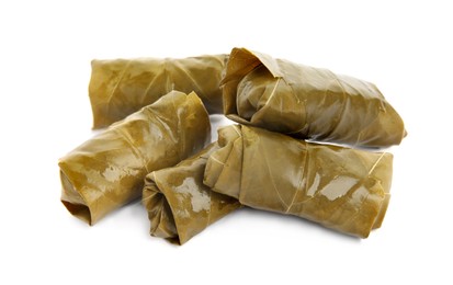 Delicious stuffed grape leaves on white background