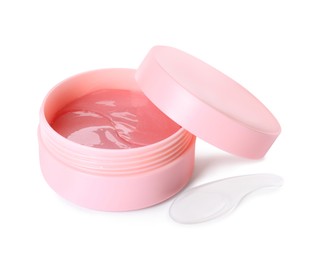 Photo of Under eye patches in jar with spatula and lid isolated on white. Cosmetic product