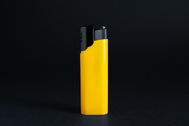 Photo of Stylish small pocket lighter on black background