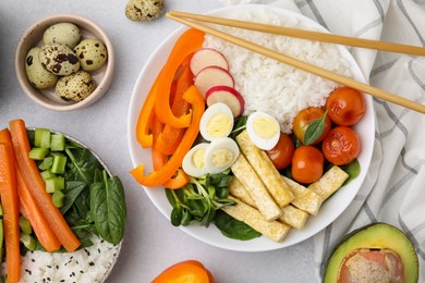 Photo of Delicious poke bowl and ingredients on light grey background, flat lay